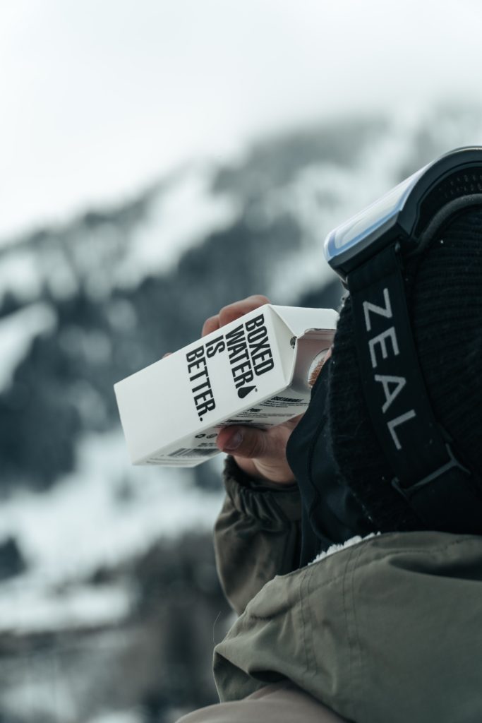 Man drinking boxed water