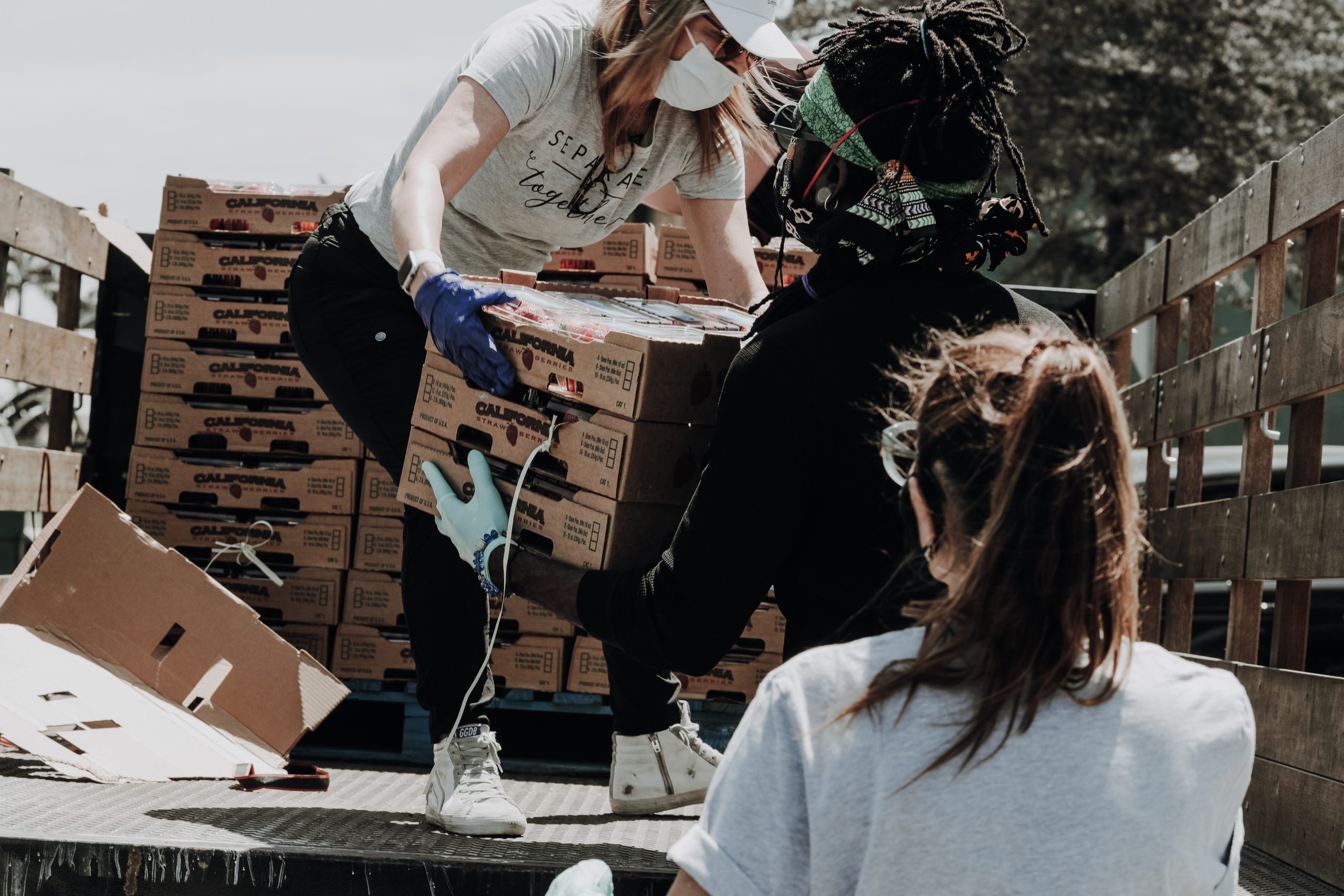 woman in white shirt helping people
